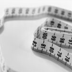 Coiled tape measure, representing weight loss progress